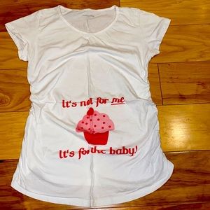 Maternity tee white with red cupcake. “It’s not for me. It’s for the baby”.